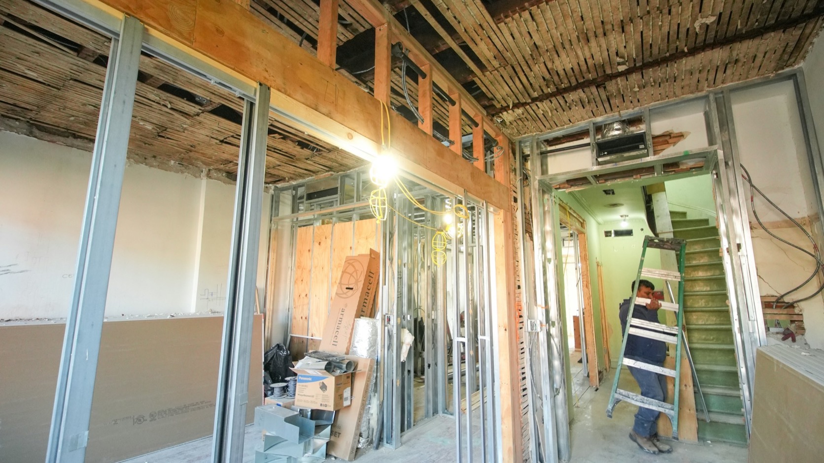 Commercial interior renovation during tenant fit-out with exposed framing and unfinished floors. Stock photo — not a Demolition Experts NY jobsite.